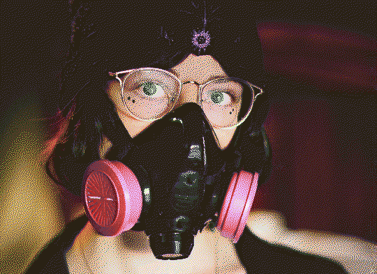 autumn wearing xyr respirator in a library