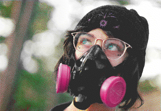 autumn wearing xyr respirator while walking through the woods